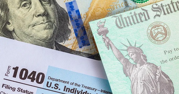 Symbols of Tax Day: currency, 1040 form, and a refund check